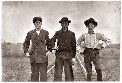 November 29, 1908. Boys working in the Eureka Cotton Mills at Chester, South Carolina. Rob Dover (tallest boy) has been in mill eight or nine years. Melvin Reilly (middle) in mill one year. Boyd McKowan is about 15 years old. Been in mill five years. Witness Sara R. Hine. View full size. Photo by Lewis Wickes Hine.
Found themSome records for Robert Dover:
#1 - b. 10 Nov 1894, d. Mar 1981 York, SC
#2 - b. 08 Mar 1893, d. Feb 1958 location unknown
Both had SS# issued in South Carolina.
If I change Boyd's last name to McGowen (k to g and a to e) I find:
b. 12 Aug 1896, d. Jun 1971 Michigan, SS issued in Michigan.
[Good work! Shorpy salutes you. - Dave]
Rob Dover and Boyd McKowanRob Dover and Boyd McKowan turned up nothing in a SSDI search result. However, I got four hits on Melvin Reilly. Seems like Melvin is a unique name. Three out of four records may match the date of this picture. 
#1 - b.17 Aug 1899 d.Dec 1972 Pittsburgh
#2 - b. 7 Aug 1901 d.Jul 1980 Huron, SD
#3 - b.15 Mar 1897 d.Jan 1963 New Jersey
[Good work! Maybe Boyd's last name was really McGowan. - Dave]
Rob DoverActually, Robert (Rob Dover) died in 1958.  This is the correct reference for him.  He was my great great uncle.  He worked for Springs Industries his entire life. 
Also, his younger brother, John Washington Dover (known as Wash and Washey in the Lewis Hine picture from the same visit to Eureka in 1908), was born in 1899 and died in 1937 at the Gayle mill, also in Chester.  That photo is available on the Lewis Hine descendants site. 
Also, Lewis appeared not familiar with Southern pronunciations of traditional Scottish names.  Boyd McKowan's name should be spelled McKeown.  His descendants also still live around Chester. 
Boyd McKeownThanks to the spelling suggestion from John Robinson, from the SSDI we find:
Boyd McKeown
born: 14 Jul 1892
died: Mar 1967
last residence: Great Falls, Chester, SC
state of SSN issue: South Carolina
(The Gallery, Kids, Lewis Hine)