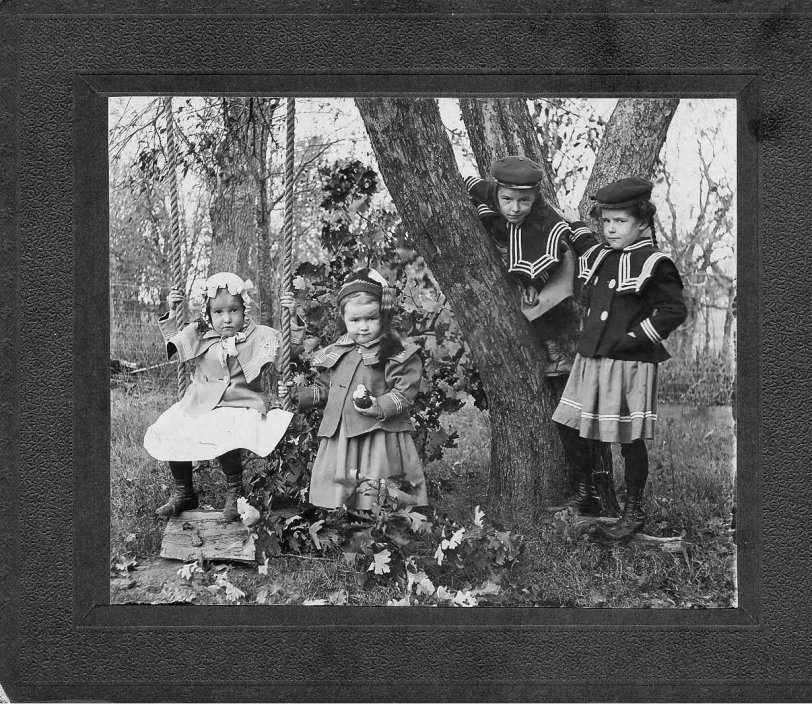 Those collars! I'd hide behind a tree too, if I had to dress like that. Late 1890s, midwest. View full size.
