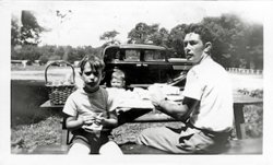 No fun for Dad and the boys. Lake Hopatcong State Park picnic grounds, 1947.
The ride home is going to be a doozyOne of those kids  is going  to get a smack in the head on the way home- you can just tell by  the look on the old man's kisser
I should know I was there.
(ShorpyBlog, Member Gallery)