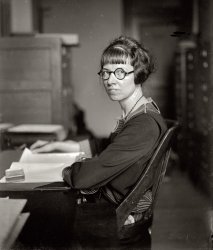 Washington, 1925. "Miss Grace M. Eddy, first woman examiner for the Interstate Commerce Commission." National Photo Co. glass negative. View full size.
GraceThose glasses are just so flattering.
Miss EddyI'm sure she was a damn fine bureaucrat!
One ringy-dingy, Two ringy-dingyLily Tomlin comes to mind.
Miss EddySetting aside all of the usual snide comments about her appearance, I really would like to know more about her story after this photo was taken. Unfortunately the only result I get by Googling Grace Eddy and the Interstate Commerce Commission is to a paid archive site and I have no desire to pay $6.25 a month just to find out if the article actually deals with Miss Grace. from what little I can find out she seems to have been a very accomplished woman - far more than just a glorified secretary.
Thank You GraceI think all women of today should thank women like Grace.  They made it possible for us to enjoy the freedoms we enjoy today.  And it seems to me that she lived up to her name.
But of course, instead we're all worried about what she looks like.
Thanks Dave for  posting her  history.
Laugh if you mustLaugh if you must, fellows.  But that woman probably helped control a preposterously large chunk of the US economy.  How much will it cost to ship a load of grapefruit from California to Michigan?  Ask Grace.  Would it be OK if you started a parcel delivery company in Iowa?  Not unless Grace says so.
Don't worry.  She never paid for her own drinks.
Flattering Glasses?Yes, but the hairdo more than makes up for them...
Miss Jane Hathaway!Milburn Drysdale: "Miss Hathaway, would you come here, please?"
Where&#039;s Sweet Pea?I like the overbite.
Strange JobWhat, pray tell, did Miss Grace examine women for?
Grrrrrrrrr-wow!Hubba-hubba, Madame. I thought Olive Oyl was hot, but dang, baby. You can balance my ledger any time, if you know what I mean.
Where&#039;s Popeye?Where's Popeye?
Grace Eddy 1890-1981A Grace Eddy timeline, as gleaned from the pages of the Washington Post. Note in particular the final item. - Dave
1915: Purse containing $10 stolen from Grace, who lived at  2140 P Street NW, while she was at church (Epiphany Episcopal, G Street NW).
1923: Grace is on the committee planning the annual banquet of the Women's Bar Association.
1925: Grace is a speaker at a meeting of the Women's Bar Association.
1925: "Supreme Court Admits Woman." Miss Grace M. Eddy, of Wisconsin, the first woman appointed examiner for the Interstate Commerce Commission, was yesterday admitted to practice before the Supreme Court of the United States. She received her law training at George Washington University and is now treasurer of the Women's Bar Association of the District.
1927: Grace is a Maryland delegate to the national convention of the United Daughters of the Confederacy.
1930: Grace attends a garden party dinner given by the Women's City Club.
1934: Grace is a table hostess at the annual banquet of the Women's Bar Association.
1934: Grace is on the planning committee for a party given by the Wisconsin Society at the Willard Hotel.
1935: Grace is in the receiving line for a party given by the Badger Society at the Shoreham Hotel.
1935: Grace is on the planning committee for the "annual moonlight excursion" (aboard the City of Washington) of the Minnesota, Wisconsin and North Dakota state societies.
1935: Grace assists at a tea given by the American Association of University Women.
1981: Letter to the editor from Ann L. Wild of Chevy Chase.
On July 7, when Judge Sandra Day O'Connor was nominated to the Supreme Court, a friend of mine was buried. Grace Eddy, 91, became a lawyer when very few women did. She graduated from George Washington University School of Law in the 1920s and worked as a lawyer at the Interstate Commerce Commission for many years. She had to struggle because she was a woman, but she loved her work. Judge O'Connor can serve on the Supreme Court today because women like Grace Eddy dared to work hard to be what they wanted to be -- lawyers -- years ago.
French teacherShe looks like my French teacher, no good memories!
Go Grace!I would have liked to see her smiling in this pic.
GraceDave, your research took this photo from "interesting" to "fascinating."  Kind of goes to show that many of the true women's lib pioneers weren't necessarily out leading protest marches and being dragged away to jail; they were instead just doing the jobs that they loved and not letting anyone stop them simply because of their gender.
Way to go Grace!
I wonder what Grace would have to say about Gov. Palin?
[Let's not forget the many thousands of women's suffrage marchers who, only a few years before this picture was taken, helped pave the way for Grace. - Dave]
Grace...All Fleshed OutThank you Dave for your work on the timeline for Grace. She now transcends just being a photograph to being a human being. She was obviously a tenacious soul who lived the life she wanted. She is a reminder that women today stand on the shoulders of giants like dear Grace. 
(The Gallery, D.C., Natl Photo)