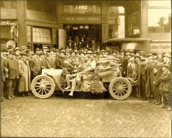 Taken by the firm of Webster & Stevens in Seattle, in the very early 1900s. The car is covered in mud and is stocked with supplies. Unsure of meaning but could probably be a cross country race. Webster and Stevens are well known photographers of historical Seattle images. They were the official photographers for the Seattle Times from 1903 to 1946. View full size.