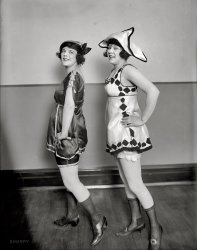 "Sidney Lust girls." Circa 1919, two of Washington, D.C., movie theater owner Sidney Lust's chorus girls, seen earlier out of costume. National Photo Company Collection glass negative, Library of Congress. View full size.
Shorpy GirlsWe see these two so often maybe they should be the Official Shorpy Girls.
Official Shorpy GirlsThese two hadn't been girls for a long time.
They liked them big-boned!Seems to me that in the early part of the century, the girl-watchers preferred the meatier ones, unlike today.  I remember my father saying he liked "something to hang onto." I also have some old posters from that era advertising weight-gaining tonic to make you pleased with "your husband's proud gaze."  Standards have changed.
Is my memory right?Did this fellow's chain of theaters eventually -- say, by the late 70s -- begin showing only "adult" movies?  I grew up in DC and seem to remember that his listings were always in the smaller print next to the regular theaters.
Lusty CinemaYour memory is right.  Starting in the late 60s, the Lust Theaters ran what would be called "soft core" porn today, but was on the edge for movie theaters of the day.  Lots of bare breasts, shower scenes, and other "suggestive" situations. No male nudity or full female nudity.
They went to this format because the Lust houses were primarily in declining areas and had lost the family or "date night" trade.  By the mid-70s, they had moved into the hard core porn then flourishing, and eventually all closed down as their locations came to be seen as too dangerous for most pornophiles.
(The Gallery, D.C., Natl Photo)