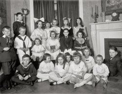 Washington, D.C., circa 1919. "Mrs. John Nolan, children's party." A good if eerie example of what happens when the shutter opens before the flash goes off. National Photo Company Collection glass negative. View full size.