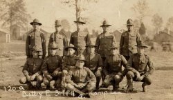 Soldiers of the 314th Field Artillery, Battery E, at Camp Lee, Virginia, 1918.  The majority of the 314th FA came from West Virginia, Pennsylvania and Ohio.  My grandfather, Corporal Millard G. Fidler of Linn, West Virginia, is in the second row, kneeling down, third from the right. View full size.