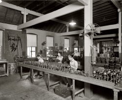 Handset assembly (or maybe rehabilitation) at the Chesapeake & Potomac Telephone Company circa 1925. National Photo glass negative. View full size. Who can spot the clues that might tell us when this photo was taken?