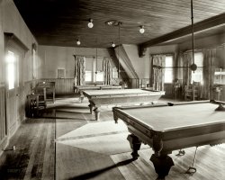 Upstate New York circa 1905. "Billiard hall at Paul Smith's casino, Adirondack Mountains." Note the pinball table in the corner. 8x10 glass plate. View full size.