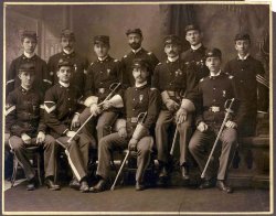 I believe this photo is post Civil War, perhaps the Spanish American War era, but I am not sure. I have an original paper photo, 8 x 10, mounted on board. 

The insignia show "USV" and "60". The officers and enlisted men are wearing the same medal, which I do not recognize. There are other interesting patches and, medals and belt buckles. The only close match I can find might indicate 7th or 8th Cavalry or First Infantry USV from 1864-1866.

An elderly client brought the photo into my custom framing business and never returned.

I would be interested in learning more from those with more military knowledge. I have it beautifully framed and get many questions and compliments. View full size.