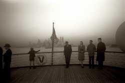 December 1941. "Lower Manhattan seen from the S.S. Coamo leaving New York." View full size. 35mm negative by Jack Delano. Office of War Information.
Sinking of the CoamoSS COAMO (December 9, 1942)
US freighter of 7,057 tons, built in 1925 for the Agwilines of New York. The vessel was en route from Gibraltar to New York when it simply disappeared without trace. It was later discovered that the ship had been torpedoed by the German U-boat the U-604. The Coamo was carrying 186 persons including the crew. The entire merchant marine crew of 133 men plus 37 Armed Guards and 16 Army personnel were lost, in this, the greatest tragedy to befall a single crew on a US Merchant Marine ship in WWII.
Interesting account and pictures here.
[Fascinating. And tragic. On a related note, the Coamo rescued 71 people from the Canadian liner Lady Hawkins after it was torpedoed and sunk by a U-boat in January 1942, with the loss of some 250 lives. In our photo, the ship is departing New York for Puerto Rico (it was named after the city of Coamo there), where Jack Delano took hundreds of photographs on assignment for the Farm Security Administration. He liked the island so much that he made his home there after the war. Three of his shipboard photos are dated November 1941; December 1941 is the LOC's "published/created" date, so it's hard to say exactly when this was taken. - Dave]
From Puerto Rico to New YorkI arrived in New York City on the Coamo. The ship was part of the Bull Lines, or the Porto Rico Line. I was 7 years old, traveling with my mother. We sailed on the 23rd of December 1937, Cabin 320, second class. The ship stopped overnight on Ellis Island to disembark immigrants from Europe and South America. The trip was uneventful, although I was seasick. I never thought I would see a picture of the Coamo. I do know that Mr. Delano lived in P.R.
(The Gallery, Boats & Bridges, Jack Delano, NYC)