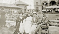 Great-grandparents, grandmother, and grandaunt at Garden Pier in Atlantic City, New Jersey, taken in the late 1910s or early 1920s, with B. F. Keith's Theatre in the background. View full size.
(ShorpyBlog, Member Gallery)