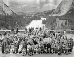 Photo stamped on back "Photograph by Associated Screen News Limited, Banff Springs Hotel, Banff, Alberta" with a handwritten "Sept. 1941" above. Original print measures 13 1/2 x 10 3/4 inches, with a hard-to-scan matte finish.
I did some minor digital cleaning (dust and creases) and converted from faded sepia to grey for better contrast. Found at a Northeast Ohio flea market in a box of old pictures and purchased for $1. It was simply an interesting pre-war photo with great scenery, people, and clothing; take special note of the John C. Reilly -like mug front and center. I bet he was a character! View full size.
WhodunitWe have the makings of an Agatha Christie novel, at least one. There is the usual cast of characters including 2 parish priests. What about the fellow in the back turned away from the camera, what's he hiding?
Miss Marple is in the rocker top left, overhearing the conversation of the two women at the wall behind her. The woman with the hankie says, "But, mother, Reginald told me that he did not know the murdered woman." Mother responds, "Of course, he always says that. Remember what happened to Gladys."
(ShorpyBlog, Member Gallery)