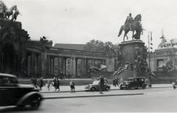 Minette Wagner posing opposite the Kaiser's Palace, Berlin, 1937. View full size.
What a differenceWhat a difference a few years makes; this shot was taken by my Uncle Walter, a tipper truck driver in the R.A.S.C. stationed in Berlin in 1945. Unfortunately US Army daytrippers spoiled his shot!
"That’s in the centre of Berlin. They’re Americans. I was going to take a photograph of this statue, and then these wagons drove in, and they started getting out. So I just took the photograph anyway!"
(ShorpyBlog, Member Gallery)