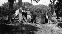 This goes with the "Stoll Car Bed" sign appearing in the "Free Air, 1920" Shorpy photo.  It's my great Uncle, Conrad Volkert, about 1924, on one of his many cross country auto trips.  His wife, Jenny, and sister in law, Frieda, also appear in the photo. View full size.