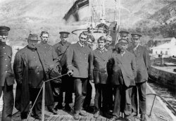 German naval and merchant marine officers on the deck of their U-Boat, possibly at the Adriatic port of Trieste. Scanned from the original German 9x12cm glass slide. View full size.