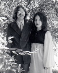 Ready for a night out (can't remember where), Barb and I (Dave) sport the latest in 1969 attire and hairstyles. In spite of rumors, these were NOT the good ol' days, but they were a lot of fun for two kids who didn't know much about life yet. Photo was taken in Atascadero, CA by my sister. View full size.
Is that a hay seed in your shoe?If you were in Atascadero in 1969, your night out was at the feed store.
Like it!Definitely a bit of a Beatle look going on there Dave!
Coolness This photo captures the look of the era perfectly.  I was only 13 at the time of the photo but I think I had a jacket similar to yours.
(ShorpyBlog, Member Gallery)