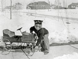 Denver Colorado 1909. Donald G. Kirk, my wife's dad, is hand cranking the car on a cold day. The make and model are unknown. The probable location is somewhere on Eudora street.
(ShorpyBlog, Member Gallery)