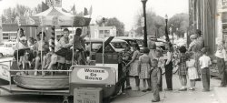 The Wonder-Go-Round made its visit to Dexter, Iowa, thanks to Adkin's Cash Foods and the Wonder Bread people in this 1950s view.  It looks like every kid in town turned out to take a spin!  View full size
(ShorpyBlog, Member Gallery, Kids)