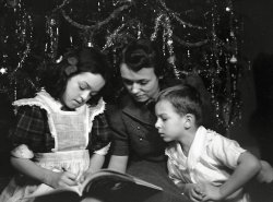 My mother Macalyne, my grandmother Brownie, and my uncle George. Christmas that year meant the end of the Great Depression and the beginning of World War II -- a momentous time in our nation's history. This photo, for me, represents all the goodness and simplicity, and the uncertainty, of those days. We have come a long way since then, for better or worse.
Those two kids grew up to be perhaps the most influential speech pathologist in the world as a professor at Vanderbilt and Purdue (Mom), and a surgeon, professor, and President of the American Trauma Society (George). Fairly successful parenting by my grandparents, I'd say.
Photo is from a large-format negative. View full size.
(ShorpyBlog, Member Gallery)