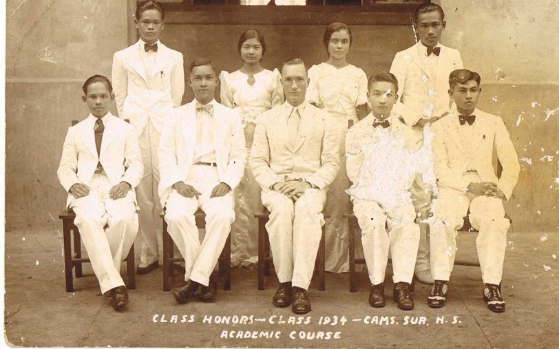 Portrait of Camarines Sur High School Class of 1934 graduates with honors with their American Principal Mr. Martin E. Eckstrand of Iowa, U.S.A. Taken in Naga, Camarines Sur, Philippines. View full size.
