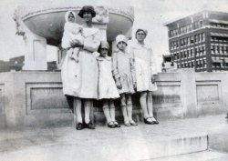 Paris, Texas on the square 1928. My Great Grandmother Sara Puckett and her children Leona (My Grandmother, she's the one with glasses), Dora, Bobby, and Bill (baby). View full size.