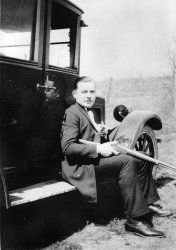 John MacDonald shows off his guns and his car sometime in the 1920's. He was an easy going gentleman. A barber by trade, he liked to joke around. He was my Grandmothers' brother, and my hero. I think this photograph was taken near Dakota Illinois where he worked in a barber shop. View full size.