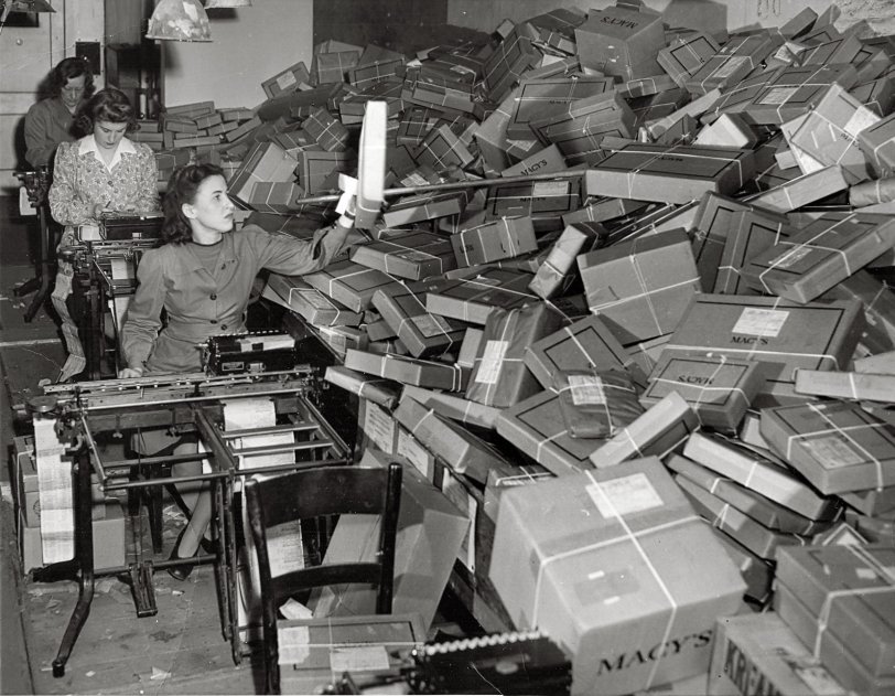 Undated, probably early 1940s photo of the shipping department at Macy's in New York. Reverse says "Wide World Photo." View full size.