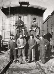 Here's a great photo of my Grandfather Mike(top right), on the back of a CPR Caboose.  He had arrived not too long before this photo was taken from the old country (Czechoslovakia). He was originally laughed at when they saw his small stature but in his broken English said to the fellow doing the hiring that if he could do the same amount of work as the 6-foot-5 Finnish fellow behind him, would they hire him -- and the rest is history.  He worked 48 years for the Canadian Pacific Railway right here in Thunder Bay, Ontario, formerly the 2 cities of Fort William and Port Arthur. View full size.