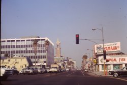 A view down a road in southern California in June of 1967. View full size.
Hooray for Hollywood!I think this is West Sunset Blvd at North Las Palmas, looking east. Riviera Motel and Hollywood Aquarium are gone, but the tower on the left is the Church of the Blessed Sacrament at 6657 West Sunset.
1 More Block WestThis is just west of the corner of North McCadden Place and Sunset, I think, not North Las Palmas, as DoninVa says, though DoninVa is right that it's the Church of the Blessed Sacrament down the street on the left. The big building on the left (just past the Riviera Motel) is still there at North McCadden Place, which is the next block west after Las Palmas.
(ShorpyBlog, Member Gallery)