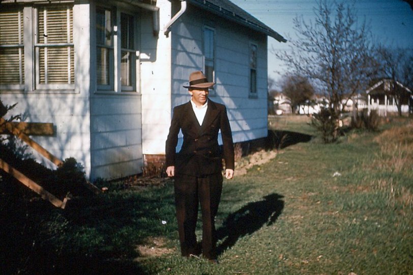 This is a photo of my Grandfather, Joseph Ditzig, taken in 1948, in front of his "kit house" built in 1926. I understood that this house was built from a kit, sold by Sears and Wards at that time. Grandfather and his brother, Uncle Hank, dug the basement after the house was built. I would have liked to have seen how they did that! The house was purchased for $1200 and sold in 1965 for $20K.
I remember a coal bin in the basement that fed a monster of a furnace, ugly with big black arms going all over! What a thing to scare a kid! But I also remember the smell of fried chicken that finally overcame the pervasive smoke of his Herbert Taryton cigarettes.
Lost Grandfather in 1961. (Thanks American Tobacco Co.) View full size.
