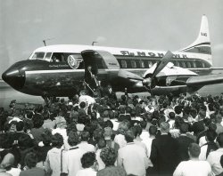 I bought a group of pictures about 7 years ago from a man in Niagara Falls. My grandmother used to take Mohawk out of Newark Airport to visit relatives in Spencerport, NY. View full size.
Body SurfingThis looks more like the front rows at a concert. There's even a guy body surfing (though it doesn't look like he intended to do it).
My guess is this is a sports team returning home after a big win.
Sterling Coopers #1 ClientOn the show Mad Men the advertising for Mohawk is handled by Sterling Cooper.
Convair 580When I was a kid in the early 80s, Aspen and Frontier Airlines were still flying those LOUD 580's on various routes between Denver and small towns like mine (Montrose, Colorado). I think the 580 was out of passenger service by around 1985. 
(ShorpyBlog, Member Gallery)