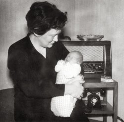 My mom with my brother in 1957