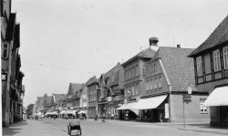 The main street of Nienburg, Germany in 1937.  Note the storks nest on top of the chimney. View full size.
(ShorpyBlog, Member Gallery)