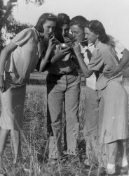 San Luis Obispo, California. My Dad (to the right) and Aunt (far left) clown with friends while sipping from a community bowl of mystery juice. This must have been about 1938 or so. View full size.