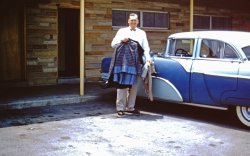 My grandfather's 1955 Packard Clipper.  Grandpa was a pastor and often traveled in the early days of his ministry.  After driving thousands of miles and saving money, he purchased his first (and only, that I know of) brand-new car.  This was taken on one of his road trips at a motel around 1956. View full size.
Bold colorsI love the bold colors that cars in the 1950s had. Today's car are boring with their drab monotonous earth-tone colors. 
(ShorpyBlog, Member Gallery)