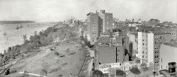 New York, October 1910. "Hudson River &amp; Riverside Park; battleships of the Atlantic Fleet." Competing for our attention with a convoy of theater posters. Panorama made from two 8x10 inch glass negatives. View full size.
Grapes of WrathIs that Ma and Pa Joad's vehicle bottom left? They're lost!
So they loaded up the truck ...I'm pretty sure that's Jed Clampett's rig in the corner.
OMG!Someone give that baby a bottle!
The DesertersAfter doing some searches on Helen Ware and "The Deserters" I can't find any reference to the film anywhere.  While Mrs. Ware's career is well documented, the film appears to have been lost to the ages. 
[As noted in the title (and caption!) of this post, the signs are advertising plays, not movies. The Deserters gave 63 performances at the Hudson Theatre.  - Dave]
Gotcha!"There is a photographer up there!"
&quot;Rebecca of Sunnybrook Farm&quot;I have heard that expressed in my family all my life. My parents weren't even born before 1918, so not sure why this little phrase or title was used. I suspect this play was popular at different times and not just in the early part of the 20th century.
I should have known it was a book. Looked it up on Ebay and there are several for sale. They have them from 1910 to 2003 printing dates.
[It's a famous children's book from 1903. The play came along later. - Dave]
Pleasant DayA lot going on here! We've got Riverside Park complete with some kids, Grant's Tomb, what seems to be an early version of New York's ubiquitous sidewalk construction awnings, and I believe that nice dome on the right is the beginning of the still unfinished St. John the Divine Cathedral. 
Yet I'm more interested in the advertisements for the theatre; I wonder if Helen Ware was America's greatest emotional actress and if "The Deserters" ended up being the best musical drama since "Arizona."
Fleet&#039;s InPresident Taft reviewed the Atlantic Fleet in Boston in November 2010, before they left for Europe, so it makes sense they were assembled in the Northeast. Quite a few references can be found to an annual event called the Hudson-Fulton Celebration, which may be what is going on here. Ships present likely include the USS Delaware, USS Rhode Island, USS Virginia, USS Nebraska, USS Missouri, and USS Mississippi. One can see them on the Hudson in 1915 in this image (from here):
[I'm pretty sure Taft was not around in 2010. The Hudson-Fulton celebration was in 1909. In our 1910 photo, the fleet was in New York for a port call after target practice, and then overhaul in the various navy yards before returning to Hampton Roads in November. - Dave]
Sorry to be fat fingered. The ships left for Europe following the Hampton Roads assembly, and after leaving England they engaged in gunnery exercises off of Cuba before returning to Virginia in January. I see what you mean about the H-F being in 1909, yet several Navy sites suggest that there was an annual event along similar lines for several years before and after the 300th anniversary. Thank you for all the images - this is a great site.
[The Hudson-Fulton Celebration, held from Sept. 25 to Oct. 9, 1909, commemorated the 300th anniversary of Henry Hudson's discovery of the Hudson River and the 100th anniversary of Robert Fulton's steam engine. For more on the ships present, click here and here. - Dave]
Will they ever finish it?I took this photo a few years back. As you can see, they added much to the front of the Cathedral of St. John, and--a hundred years later--they are still working on it!
In the meantime, Columbia University has erected very uninspired buildings that all but obstruct the street view of the cathedral.
The steeple in the background is Riverside Church.
To us who live here and see this every day, the absence of the George Washington Bridge in the 1910 picture is most glaring. 
&quot;An infant is necessary&quot;The partly-obscured poster with the scary infant advertises "Baby Mine," a farce by Margaret Mayo that opened in August 1910. I found this description:
"To retain her husband's affection, Zoie determines that an infant is necessary. She hates babies, but she does love her husband -- so, while he is away, she rents a couple of twins from an adjacent laundress, and the fun sets in!"
Riverside ChurchConstruction on Riverside Church didn't begin until the 1920s.  If it were on the photo it would be just to the right of Grant's Tomb.
The tall building in the foreground is at 85th and Riverside Drive.  Pretty much all the mansions along Riverside Drive were soon replaced with much larger apartment buildings.
Behind and to the left of St. John the Divine is St. Luke's hospital.  The dome way in the background is a mystery to me.  It must be where Columbia's east campus is located.
Milwaukee FamousHalf hidden among the theater signs is a billboard for Schlitz, "the beer that made Milwaukee famous". I remember that slogan and the logo were current 60 years after this photo. Apparently they weren't much for new campaigns.
St. John the UnfinishedYes, that is the Cathedral of "St. John the Unfinished." They found stone carvers in Italy a few years back who were able to carve stone in the same manner as the ones who most likely worked on the portion of the Cathedral seen here and finally completed the edifice a few years back, from what I understand.  
Can you spot the Power Broker?There's a non-zero chance that one of the automobiles seen on Riverside Drive contains a young Robert Moses. This is where he got his formative idea of the parkway, which was for the weekend pleasure of the leisure classes. He would be riding in the back seat, naturally. As the century moved on and the automobile's role evolved from plaything of the rich to everyman's necessity, Moses never changed his views, and by the 1930s, he had the power at his disposal to see that his plans were carried out. Never mind that the motorist of 1931 or 2011 would be too busy negotiating traffic to enjoy the view! Driving was for the help! Robert Moses spent his career building highways, but never held a driver's license, and he lived to be 92.
Grant&#039;s Tomb (+13)

Washington Post, Aug 11, 1885


The Riverside Park Tomb.
The Views of Landscape Engineer Olmstead &mdash; The Actual Site of the Monument Not Determined.

New York, Aug 10. &mdash; Last week Frederick Law Olmstead, the landscape engineer, who was detailed to select a site for Gen. Grant's monument, wrote a letter to Park President Crimmins, in which he expressed the opinion that the site chosen for the Grant tomb and proposed monument in Riverside Park was not a suitable one. It would be extremely unfortunate, he thought, if the remains of the dead hero were brought into close association with the gayety of the promenade, or if the city adopts plans for the terminal arrangements of the promenade which would destroy its main character, or which will prevent the promenade from having the great northern view as its terminus.
The letter has caused a great deal of discussion, and Mr. Calvert Vaux, the landscape gardener of the Central Park has replied to it at length. He says that there is nothring in the most of Mr. Olmstead's objections. He favors erecting the monument and final tomb on the southern portion of what is called "the loop," and then it would be practically out of the park with a public road all around it. Small pathways leading to it for foot passengers could also be made and the view from the drive and park would be in no way impaired.
 Mayor Grace said today: The actual site for the monument, or what sort of a monument it will be, has not yet been decided upon. I do not think a better site could possibly have been chosen than the one near the temporary tomb, and there is plenty of room there for a very large monument without in the least obstructing the view or in any way destroying the beauty of the spot. I shall certainly take no action in the premises. The whole matter will be referred to Mr. Vaux and Superintendent Parsons, and they will report to the park commissioners as to the best site for the proposed monument.
It was said at the office of the park commissioners to-day that the plan of laying out the northern part of Riverside Park had been modified to correspond to a great extent with the views of Mr. Olmstead. At first it was intended to have the permanent monument at a point about two hundred feet north of the tomb, but it will not be placed directly back of and near the tomb.
The Claremont House will remain and the handsome bluff will be reserved for those who visit it for recreation.  From One Hundred and Twenty-first street to One Hundred and Twenty-fifth street in the park will be set apart exclusively for the burial ground of Gen. Grant, and a roadway will be laid out north and south of the tomb on a line with One Hundred and Twenty-fifth street, so as to separate the burial ground from the other portions of the park.
The park commissioners have determined to secure the land lying east of Riverside Park, extending to Claremont avenue to one side and One Hundred and Twenty-second street to One Hundred and Twenty-fifth street on the other. As soon as the park commissioners have secured a title to these grounds in the vicinity of the tomb, and thus the necessary quiet will be secured to the spot in which the General's remains are deposited.
The key of the vault is kept in the large safe in the park commissioner's office.

To your left, Grant&#039;s TombHow about that double-deck bus down in the lower left? A dated version of the current crop of open air vehicles that are seen all over Manhattan, even on rainy days.
Beautiful!As someone who gets off the subway a stop early just so I can walk up Riverside Park, I thank you for the picture. The buildings may change, but the joy of a stroll through the park remains the same. 
Mr PumpkinheadIt's probably a fancy dressed lady in a big hat, but from this angle doesn't the person on the path, at the bottom of the picture, look like Mr. Pumpkinhead with a long coat?
(Panoramas, Boats & Bridges, DPC, NYC)