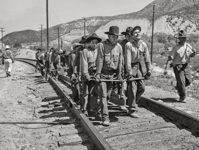 March 1943. "Cajon, California. Indian section gang working on the Atchison, Topeka and Santa Fe Railroad track." Photo by Jack Delano, Office of War Information. View full size.
