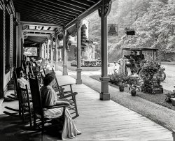 Circa 1905. "Front piazza of Kittatinny House, Delaware Water Gap, Pennsylvania." An up-to-date inn catering to the automobilist with such amenities as cafe and public telephone. 8x10 inch glass negative. View full size.
Lost to HistoryThe name of the first parent to utter the phrase "Don't make me stop the car!"
Hotel burned in 1930A scenic overlook (a rest stop!) was built on the location where the hotel once stood, and is located along Route 611.
View Larger Map
A little backgroundFrom the Pocono Record; click here.
Who knew?Never knew we had a piazza - we called it the porch.
Wouldn&#039;t you rather have a Winton?At least, with the scroll on the body, the odd fender/running board, and handy basket, that's what it looks like to me. Photo is a 1904 model.
Note the neatly matching license plate(?) and numbered running light lenses. Also note what looks like a giant windshield frame but is probably just a support for the canopy. There doesn't seem to be any glass in it.
License plateNice shot of what is known as a "pre-state" plate, i.e., one produced before states began issuing plates. These plates would be made by the car owner, often using a kit supplied for the purpose [similar plates existed for horse and buggy use earlier], and the plate number would be registered with the local authorities.
Most northeastern states such as Pennsylvania had state-issued plates by 1910, but the pre-state plates continued to be used through the 1910s [for instance, our first state-issued plates here in Texas didn't come out until 1917]. Many Texas pre-state plates even had the name of the town or city in addition to the registration number.
Ain&#039;t Fair!Dad gets to wear that spiffy coat and hat with neat engineer gloves and I have to dress like a reject from Miss Priscilla's Paisley Perambulators. 
(The Gallery, Cars, Trucks, Buses, DPC)