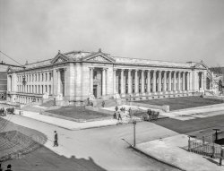 Memphis, Tennessee, circa 1910. "Shelby County Courthouse, Adams Avenue and Second Street." 8x10 inch dry plate glass negative, Detroit Publishing Company. View full size.
Tree CartThe two guys with the Harpo Marx hats sitting on trees (?) in the cart seem to be the only ones aware of the photographer.  Who is probably somewhere on the building casting the foreground shadow.  Always amazed at the details in these photos.
Where are the togas?The classical architecture makes me think Shelby is the most distinguished, important county in the nation, and you darn well better be impressed.
It&#039;s a multiuse buildingThis impressive building was designed by James Gamble Rogers, best known for his academic commissions at Yale University, Columbia University, and Northwestern University.  And if you click on Google Earth, you will read that this 1909 courthouse with Ionic columns was featured in the movie 'Silence of the Lambs.'
Authority, Justice, Liberty, Peace, Prosperity, &amp; Wisdom.The statues pictured on July 6, 2024.
(The Gallery, DPC, Memphis)