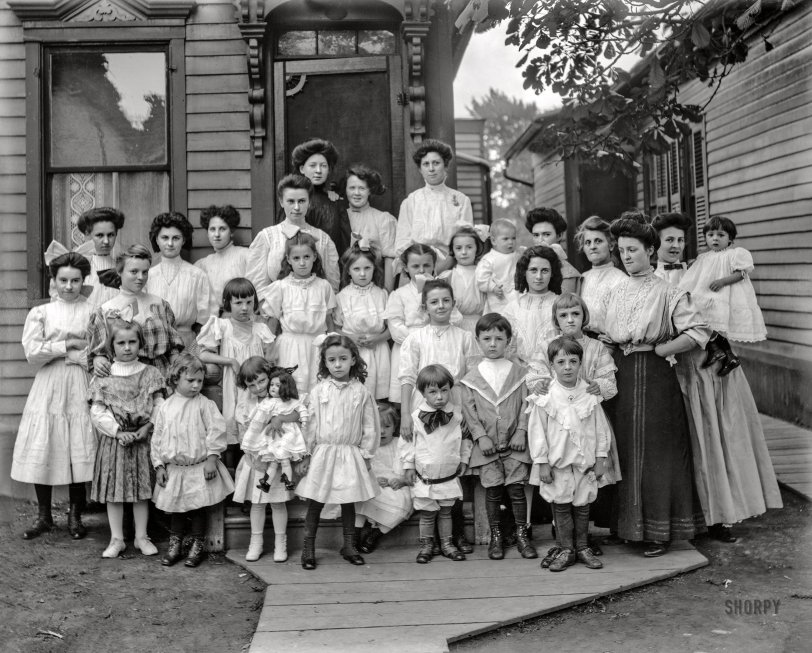 Detroit circa 1910. "Group in front of house, possibly schoolchildren and teachers. 'Mrs. R. Jacque' on negative." 8x10 inch glass negative, Detroit Publishing Company. View full size.