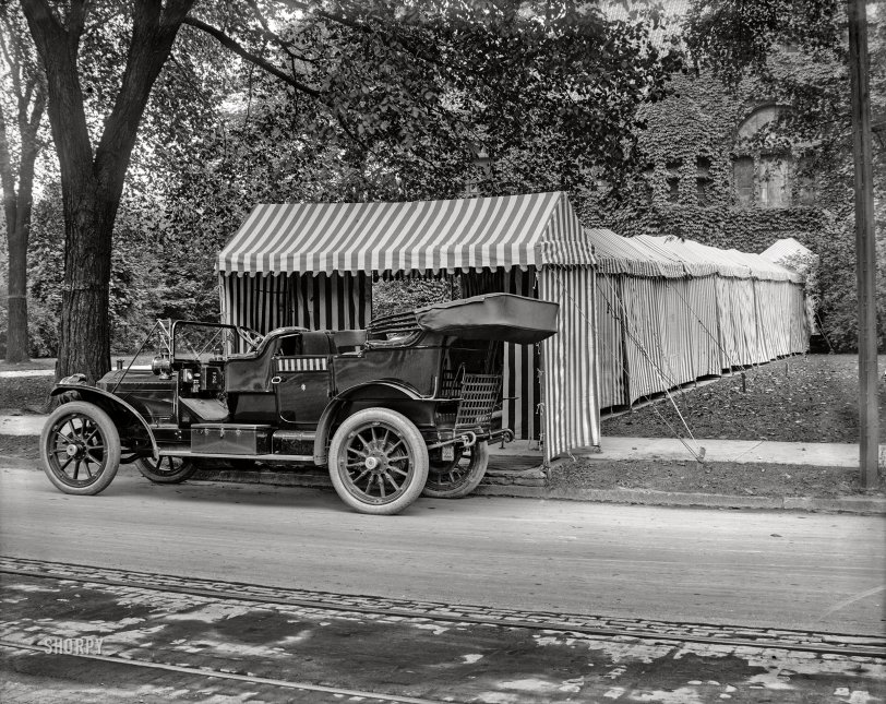 Detroit circa 1908. "Packard touring car and tented entrance to club or dwelling." Door trim coordinated with the striped marquee. 8x10 glass negative, Detroit Publishing. View full size.