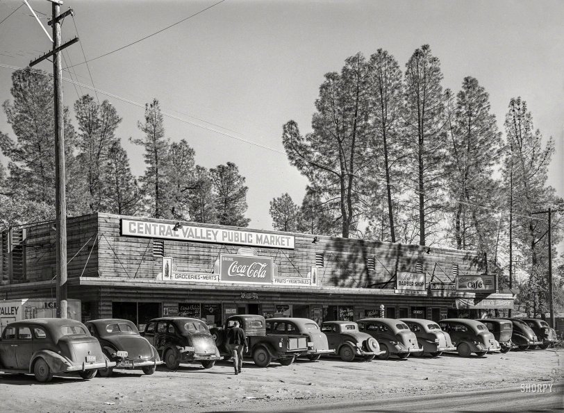 November 1940. "Shopping centers are springing up at the small towns near Shasta Dam site. This one was at Central Valley, California." Medium format negative by Russell Lee for the Farm Security Administration. View full size.