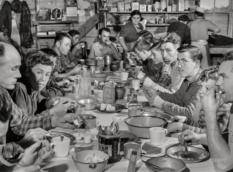 October 1940. "Lunch hour at one of the farms of the Woodman Potato Co. All of the pickers and field laborers eat in this converted tool house, 11 miles north of Caribou, Maine." Acetate negative by Jack Delano for the FSA. View full size.