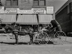 September 1941. "Enosburg Falls, Vermont. Shopping on a Saturday afternoon." Photo by Jack Delano for the Farm Security Administration. View full size.