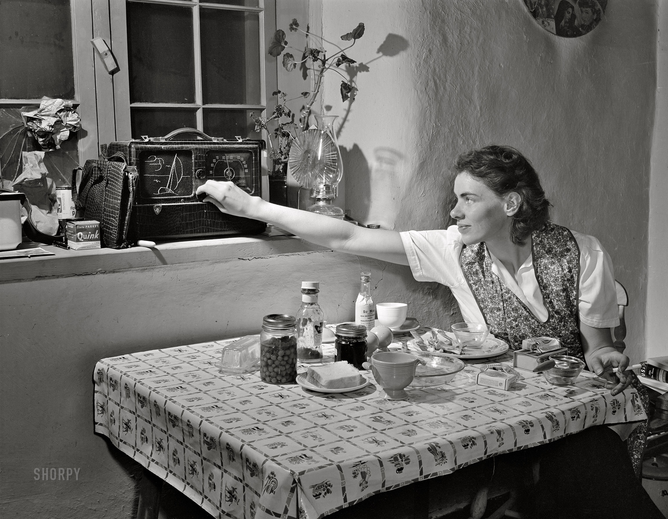 January 1943. Penasco, New Mexico. "Marjorie Mueller, Red Cross nurse at the clinic operated by the Taos County cooperative health association. The radio is her only contact with the outside world. Papers come rarely to the town, and she must depend on news broadcasts to follow daily events." Acetate negative by John Collier,  Office of War Information. View full size.