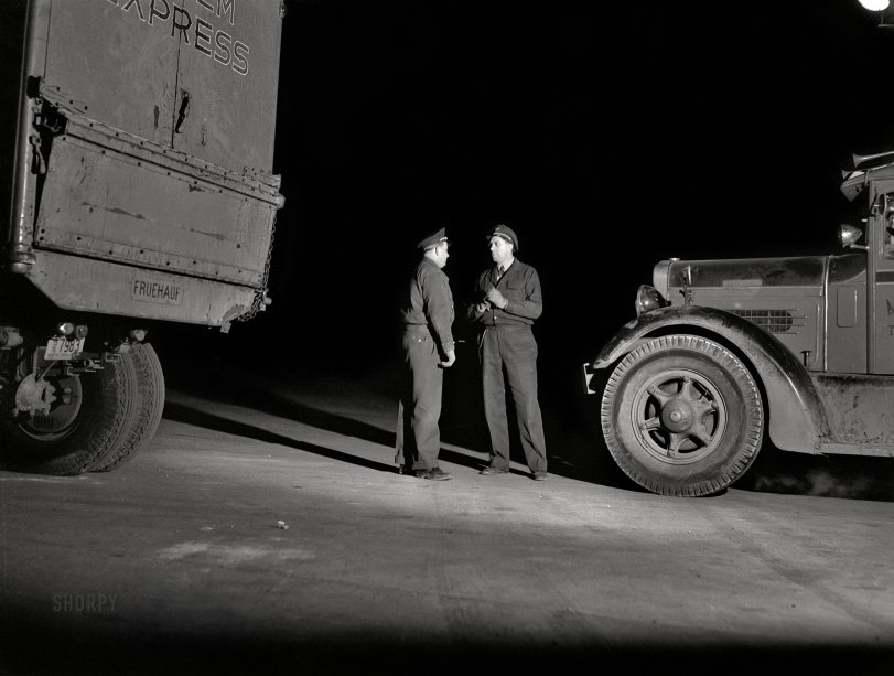February 1943. "Truckers talking outside a diner on U.S. Highway 40 in Delaware." Acetate negative by John Vachon for the Office of War Information. View full size.