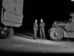 February 1943. "Truckers talking outside a diner on U.S. Highway 40 in Delaware." Acetate negative by John Vachon for the Office of War Information. View full size.
Truck IDLooks like a Corbitt.
Headed for the ferry?There are only about 17 miles of US 40 in Delaware, between Maryland and New Jersey. Though it was a major highway, in 1943 you got into New Jersey by ferry across the Delaware River, replaced in 1951 by the Delaware Memorial Bridge. US 40 was originally the historic National Road (1811), but none of that was in Delaware because it headed west from Cumberland, MD. 
The stretch of US 40 that John Vachon photographed is still there; you may find yourself stop-and-going on it if you decide to take a break after the southbound New Jersey Turnpike and the Delaware Memorial Bridge.
[Below, Vachon's photo (an inadvertent double exposure) of "trucks on the Pennsville Ferry between New Jersey and Delaware." - Dave]

Go thatawayAnd you'll see them. The aliens, I mean. In ships shaped like saucers.
Don’t look at that guy over there with the floodlight ..." … but should we grab our tire irons and see if he’s a German spy?"
Truckin&#039;From 1939-1945 Corbitt designed and built over 3,200 50SD6 six-ton, 6×6 prime movers for the U.S. Army. These trucks were equipped with either the 779 or the 855 cubic-inch Hercules 6-cylinder gasoline engine. They were used in every theater of operation during World War II. Corbitt lacked production capacity for all the trucks needed, so White, Brockway, Ward LaFrance, and FWD all built the same or very similar trucks. Altogether, over 10,000 of these trucks were built by the five manufacturers.
(The Gallery, Cars, Trucks, Buses, John Vachon)