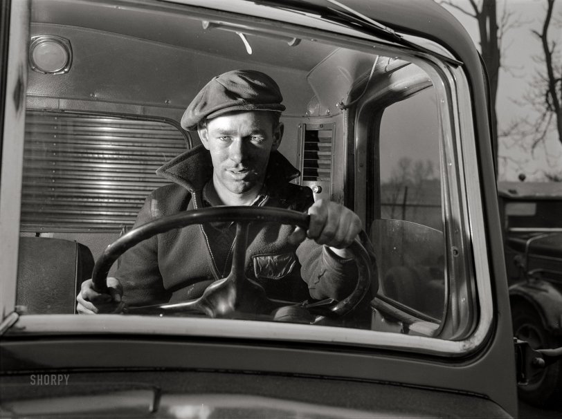 March 1943. "Baltimore, Maryland. Associated Transport Company trucking terminal. 'Yard jockeys' or 'spotters' drive trucks around the terminal and back them up to the loading platform." Acetate negative by John Vachon for the Office of War Information. View full size.
