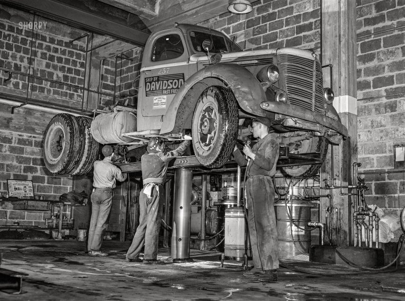 March 1943. "Baltimore, Maryland. Davidson Transfer Company trucking terminal. Lubricating a truck tractor." Acetate negative by John Vachon, Office of War Information. View full size.

