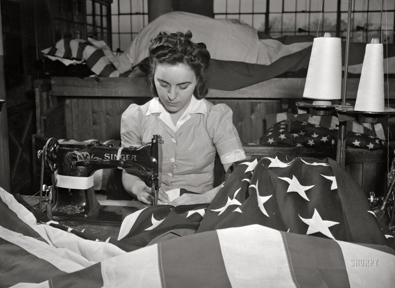 March 1943. "Verona, New Jersey. Sewing the edge of an American flag at the Annin Flag Company." Acetate negative by Marjory Collins for the Office of War Information. View full size.

