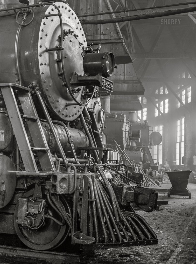 March 1943. "Shopton, near Fort Madison, Iowa. Locomotives in the Atchison, Topeka and Santa Fe Railway roundhouse. Note train control mechanism on truck wheel of the engine." Acetate negative by Jack Delano for the Office of War Information. View full size.