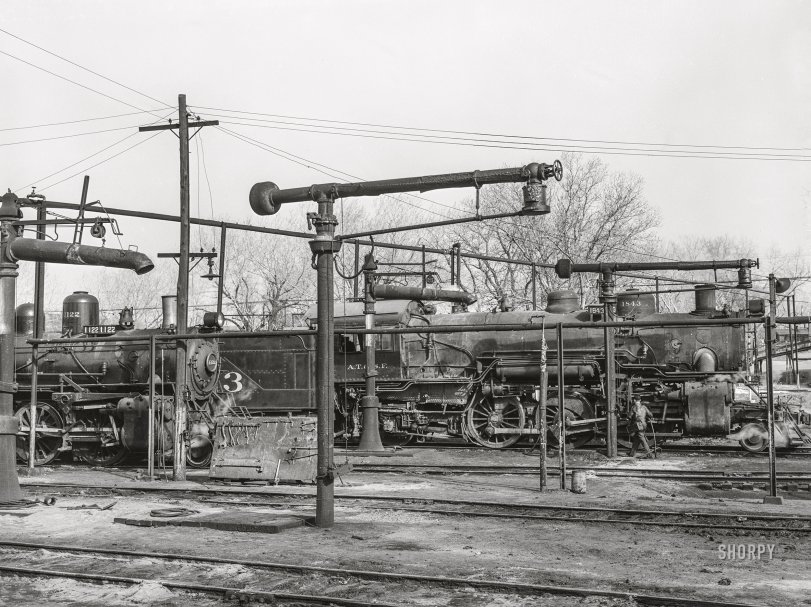 March 1943. "Waynoka, Oklahoma. Oil and water derricks near the Atchison, Topeka &amp; Santa Fe Railroad roundhouse." Photo by Jack Delano, Office of War Information. View full size.
